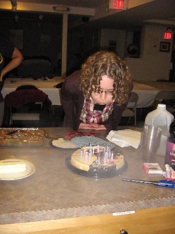 Blowing out the candles on the birthday cheesecake (Fall 2012)